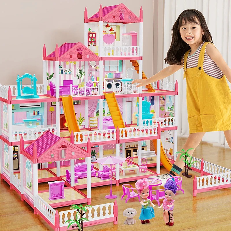 Large pink princess dollhouse playset arranged for imaginative play