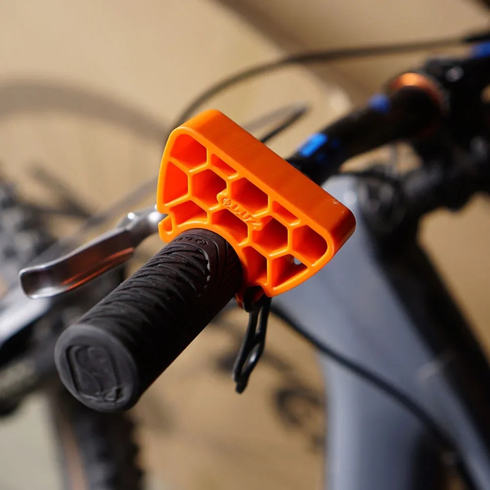 Bike handlebar stabilizer fitted around a bicycle grip