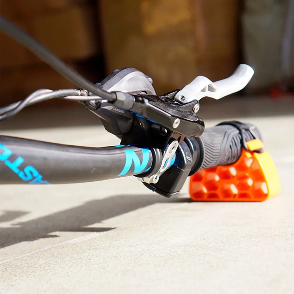 Bicycle handlebar controls raised from the ground by a stabilizer stand