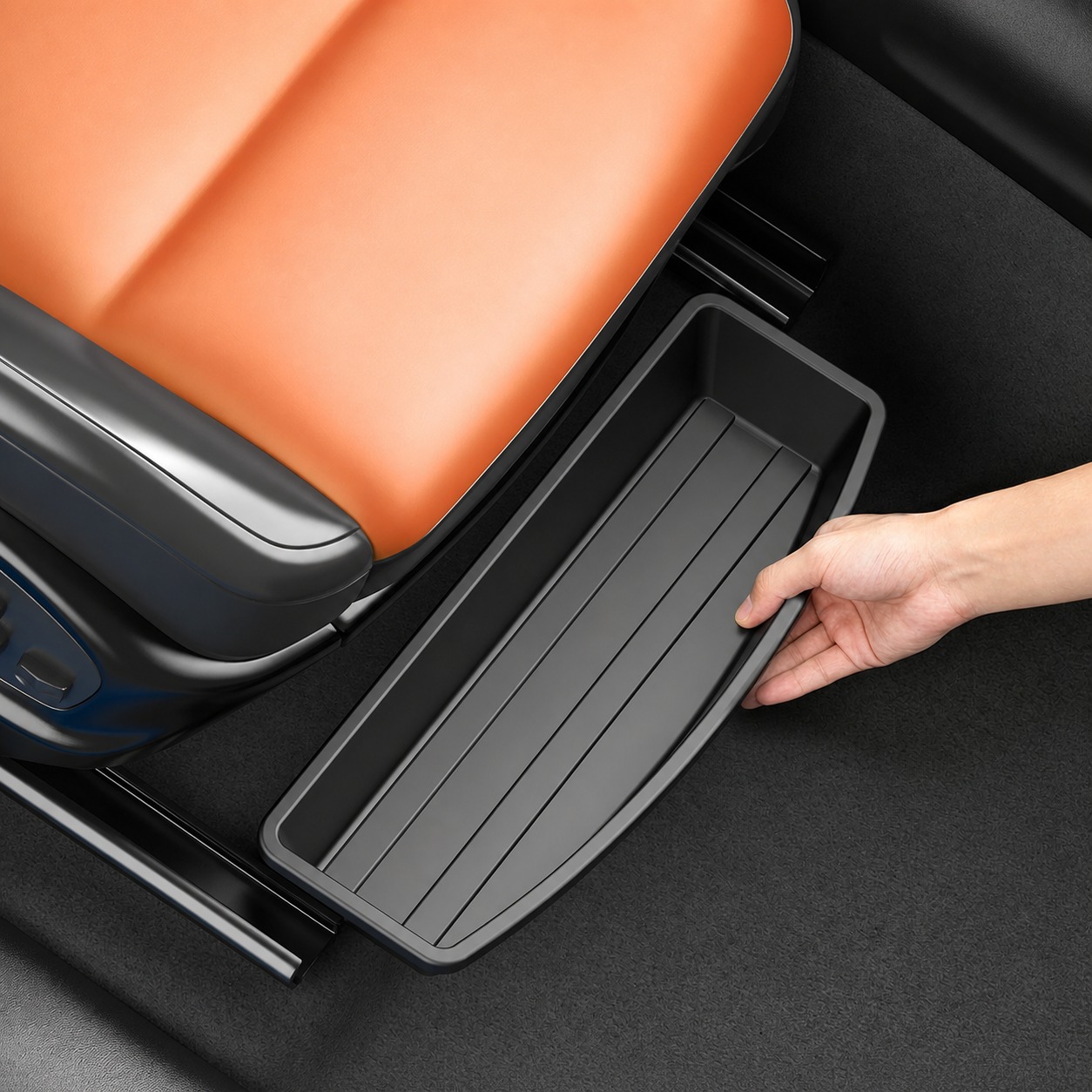Black storage box sliding into the open area beneath a car seat